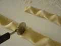 Cutting the tortelli mounds using a pastry wheel cutter Cutting the tortelli mounds using a pastry wheel cutter