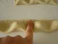 Pressing tortelli pastry down to seal Pressing tortelli pastry down to seal